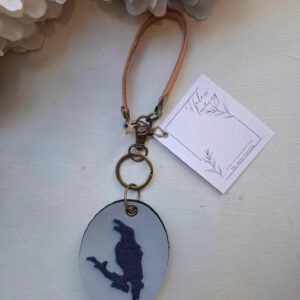 Reflecting keychain "Raven and a cat"