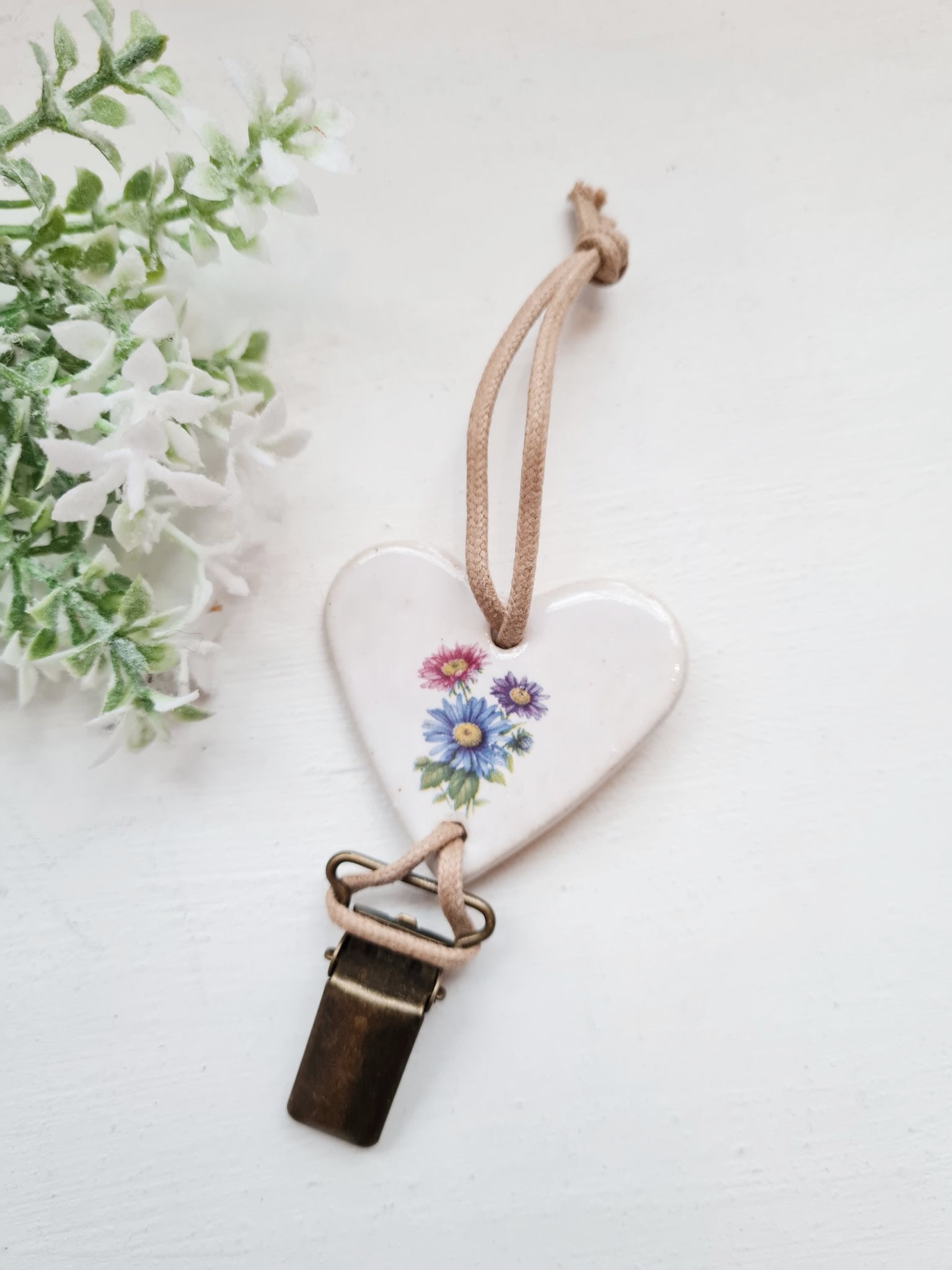 Lillekimbu pildiga käterätikuhoidja