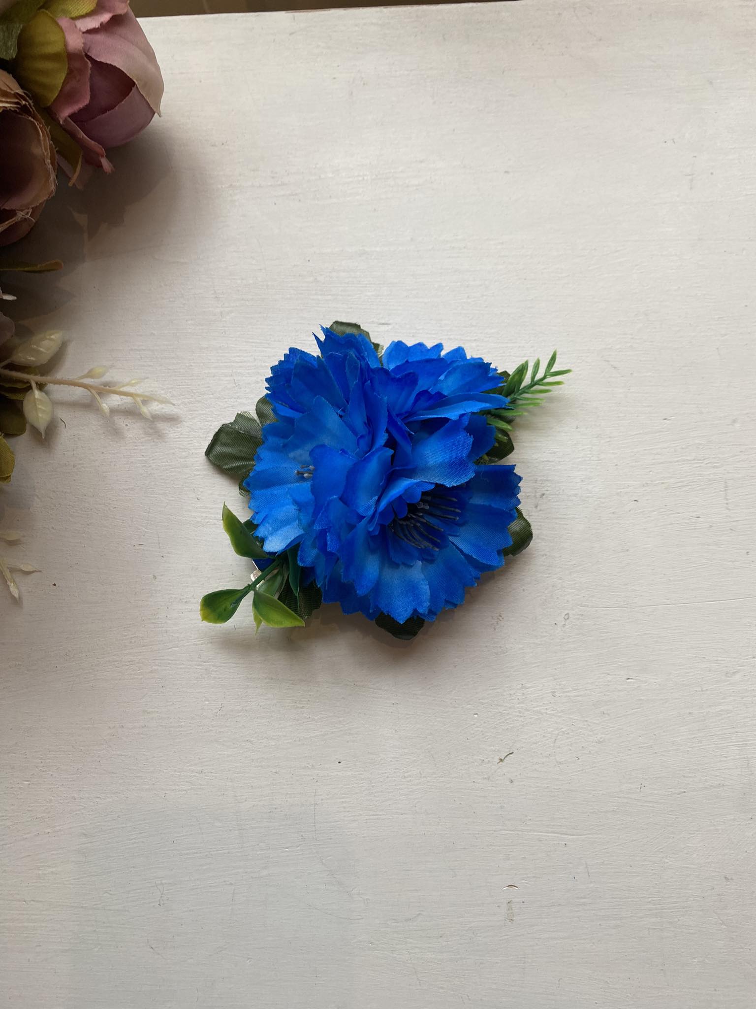 Rahvusromantiline juukseklamber- rukkilill