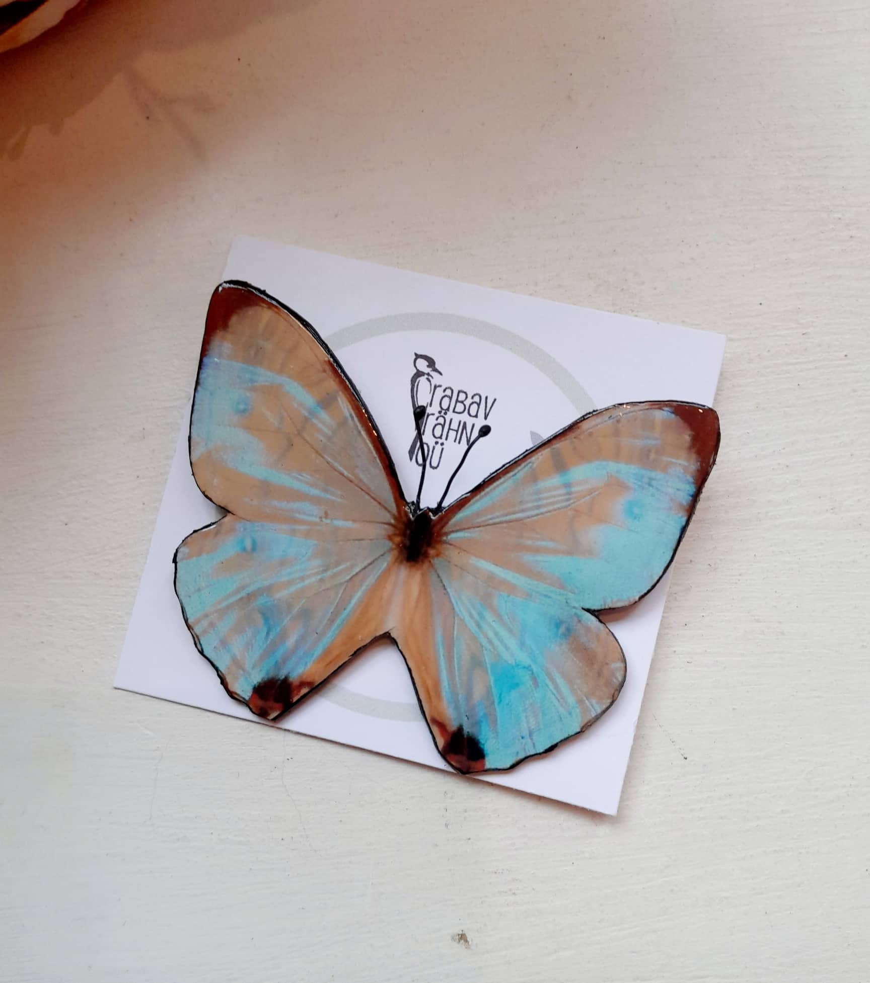 Käsitsi meisterdatud liblikakujuline pross